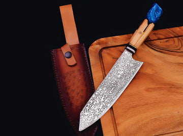 Decorative knife with a wooden handle on a wooden cutting board next to a leather sheath.